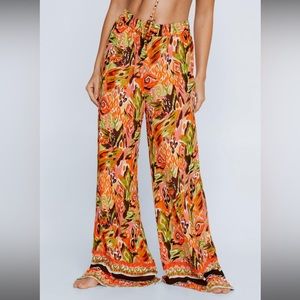 NastGal (crinkle rayon border print trousers)
